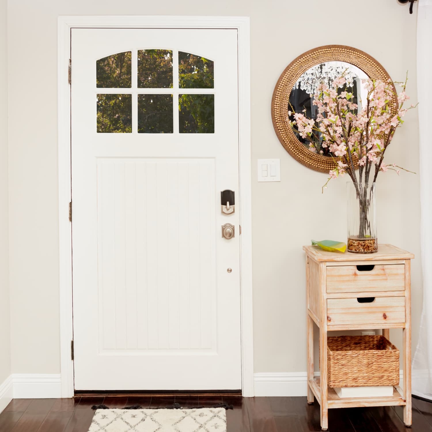 Schlage Encode Smart WiFi Deadbolt with Camelot Trim (for Works with Ring Video Doorbells and Cameras) - White front door with Schlage Encode Smart Wi-Fi Deadbolt with Camelot Trim, shown in a bright home entryway.