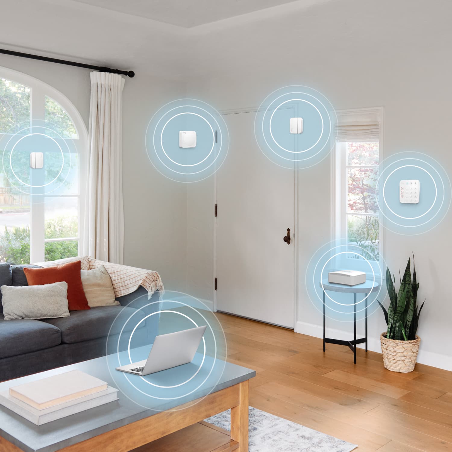 Alarm Security Kit, 5-Piece (for 2nd Generation) - Modern living room with Ring Alarm Security Kit devices highlighted, showing connected sensors, keypad, and base station. 