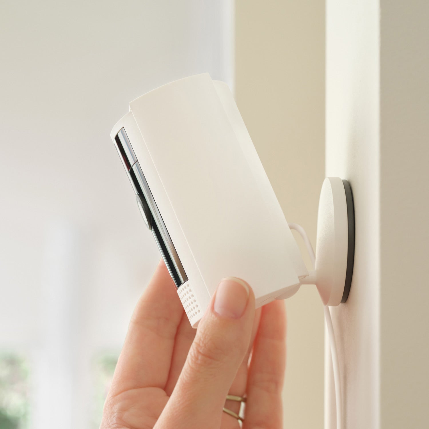 Outdoor Cam Plus Battery + Indoor Cam (2nd Gen) - Video showing white Ring Indoor Cam Plug-In monitoring rooms, showing live views, working with Alexa, use of privacy cover, and highlighting alerts and remote alarm. 