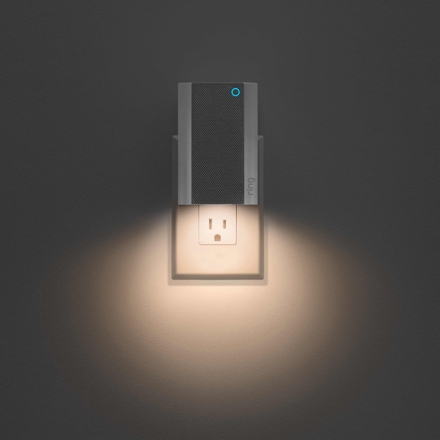 Battery Doorbell Plus with Chime Pro - Ring Chime Pro plugged into a wall outlet, with downward-facing light illuminating the wall and space below.