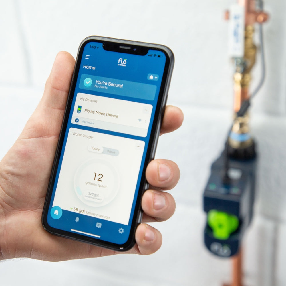 Flo by Moen 1-Inch Smart Water Shutoff (for Works with Ring) - Smartphone displaying Flo by Moen app showing water usage, near installed Flo Smart Water Shutoff valve on copper pipe.