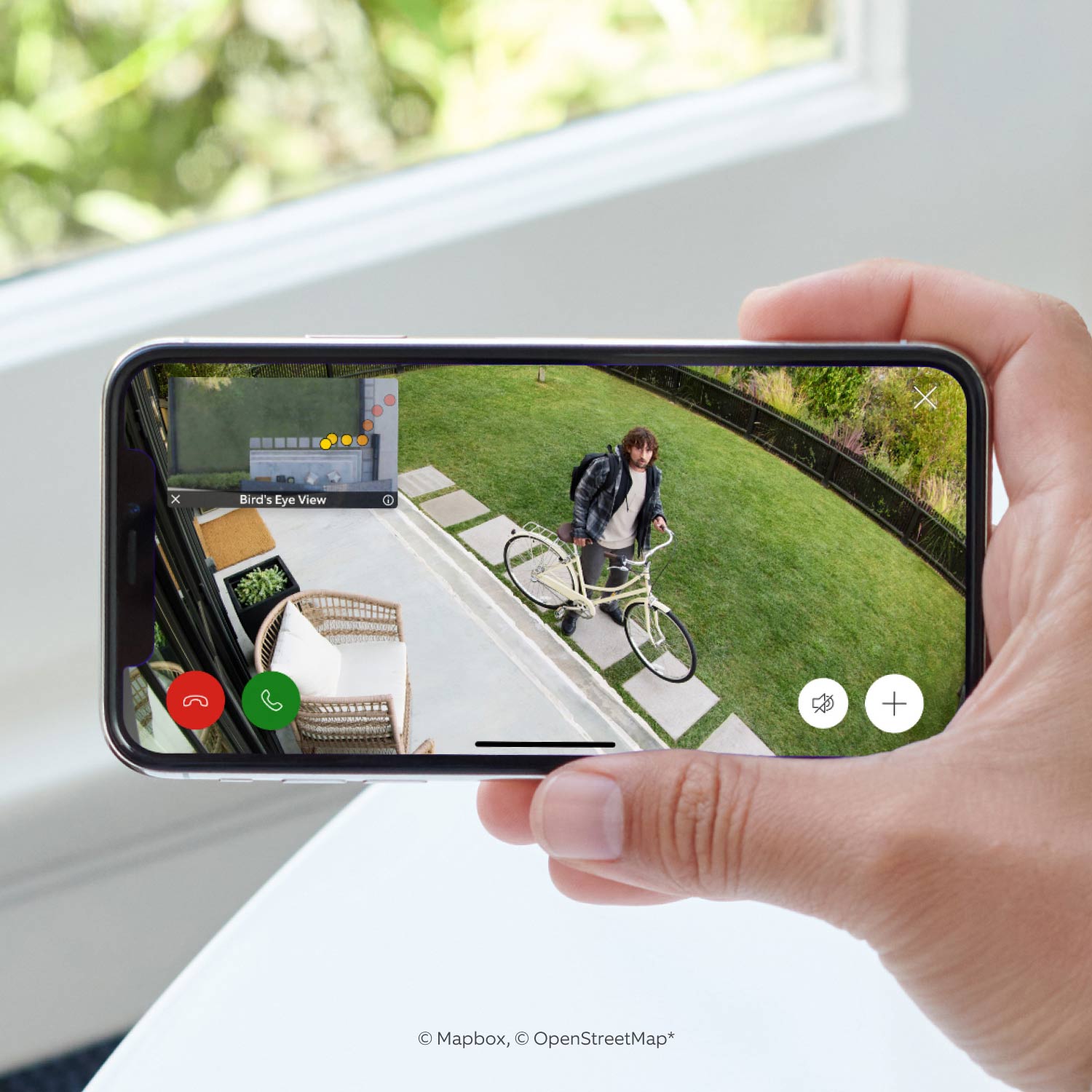 Stick Up Cam Pro (Certified Refurbished) - Battery:Live Ring Stick Up Cam Pro feed of person with bike on a lawn, with call, mute, and zoom options on screen.