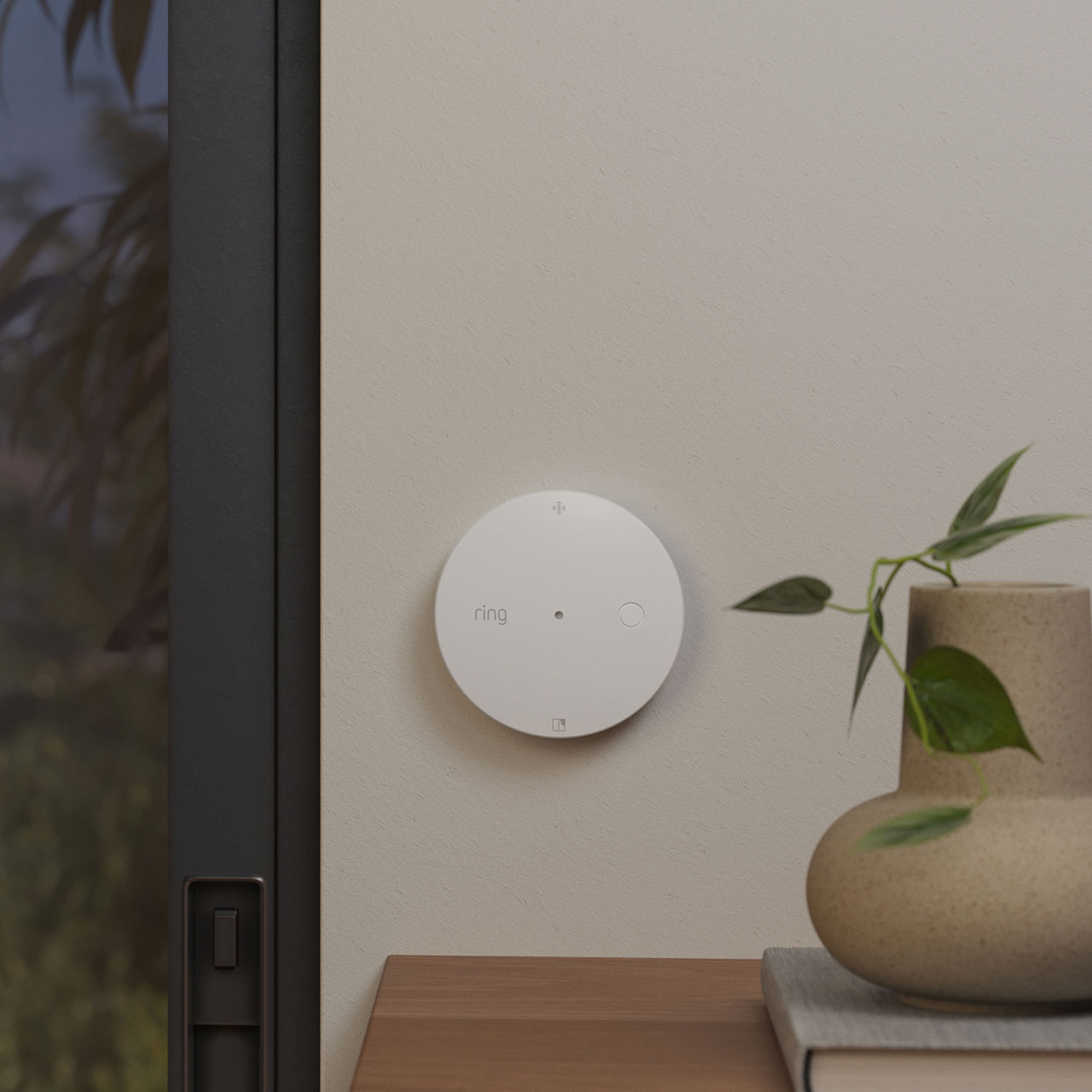 Glass Break Sensor (Newest Model) - White round Glass Break Sensor mounted near a window.