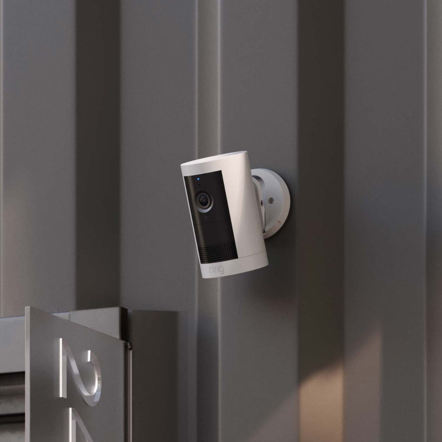 Restaurant Starter Kit (Outdoor Cam Plus Battery + Indoor Cam) - A white Ring Outdoor Cam Plus mounted onto an industrial metal wall.