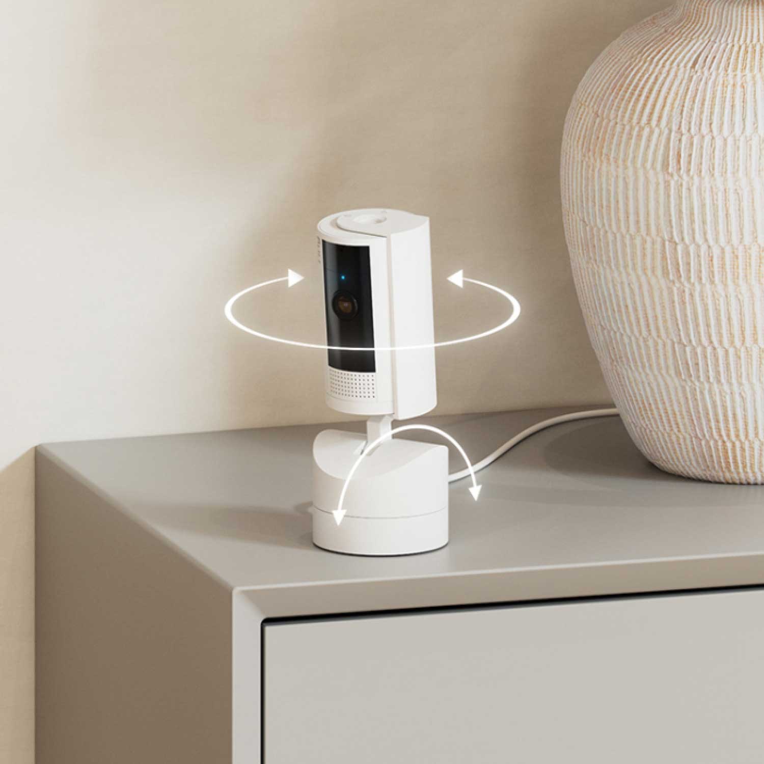 Outdoor Cam Plus Plug-In + Pan-Tilt Indoor Cam - Pan-Tilt Indoor Cam swiveling on a desk.