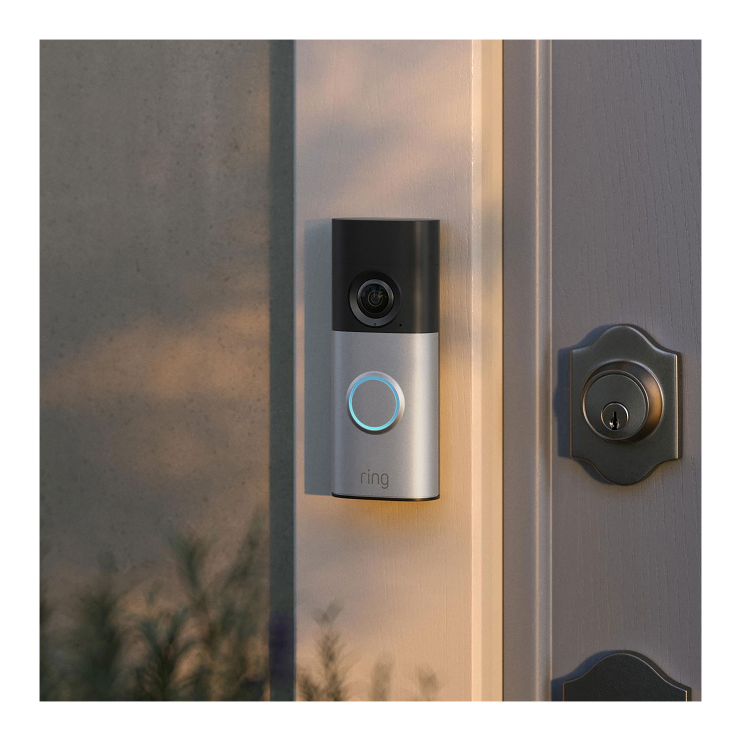 Wired Doorbell Plus (Newest Model) (Featuring Retinal 2K) - Wired Doorbell Plus (2nd Gen) mounted on a white door next to a door lock, with natural lighting creating a subtle marbled shadow effect across the surface. 