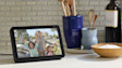 Amazon Echo Show on kitchen worktop next to wooden bowl and hob