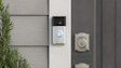 Ring Video doorbell mounted next to front door with decorative lock