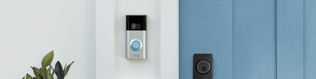 Ring Video Doorbell mounted next to black door lock