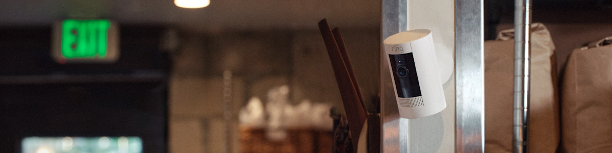 White Ring security camera mounted on wall