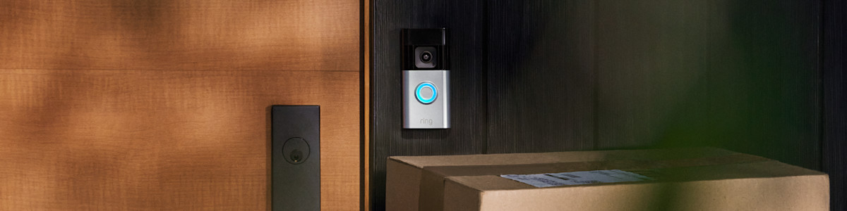 Ring Video Doorbell mounted on wooden door with parcels below