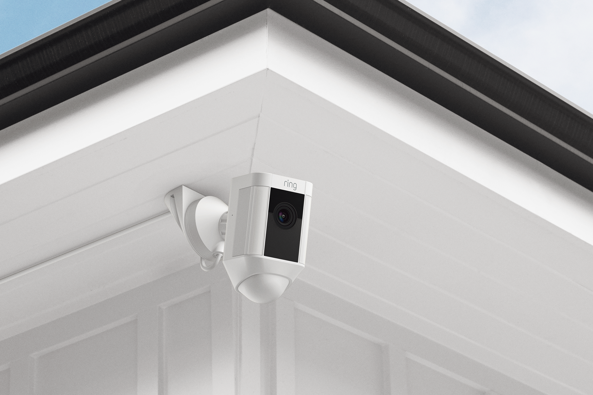 Ceiling Mount for Spotlight Cam Wired - Ring Spotlight Cam Wired mounted under corner eaves of home, angled downward for optimal motion detection and coverage.